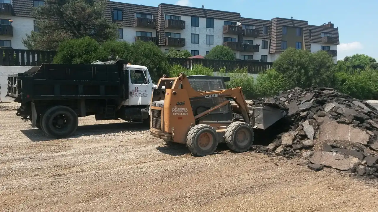 destroying old asphalt by paving contractors Grayslake